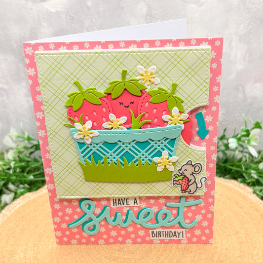 Handmade birthday card with strawberry design and 'Have a sweet birthday!' text.