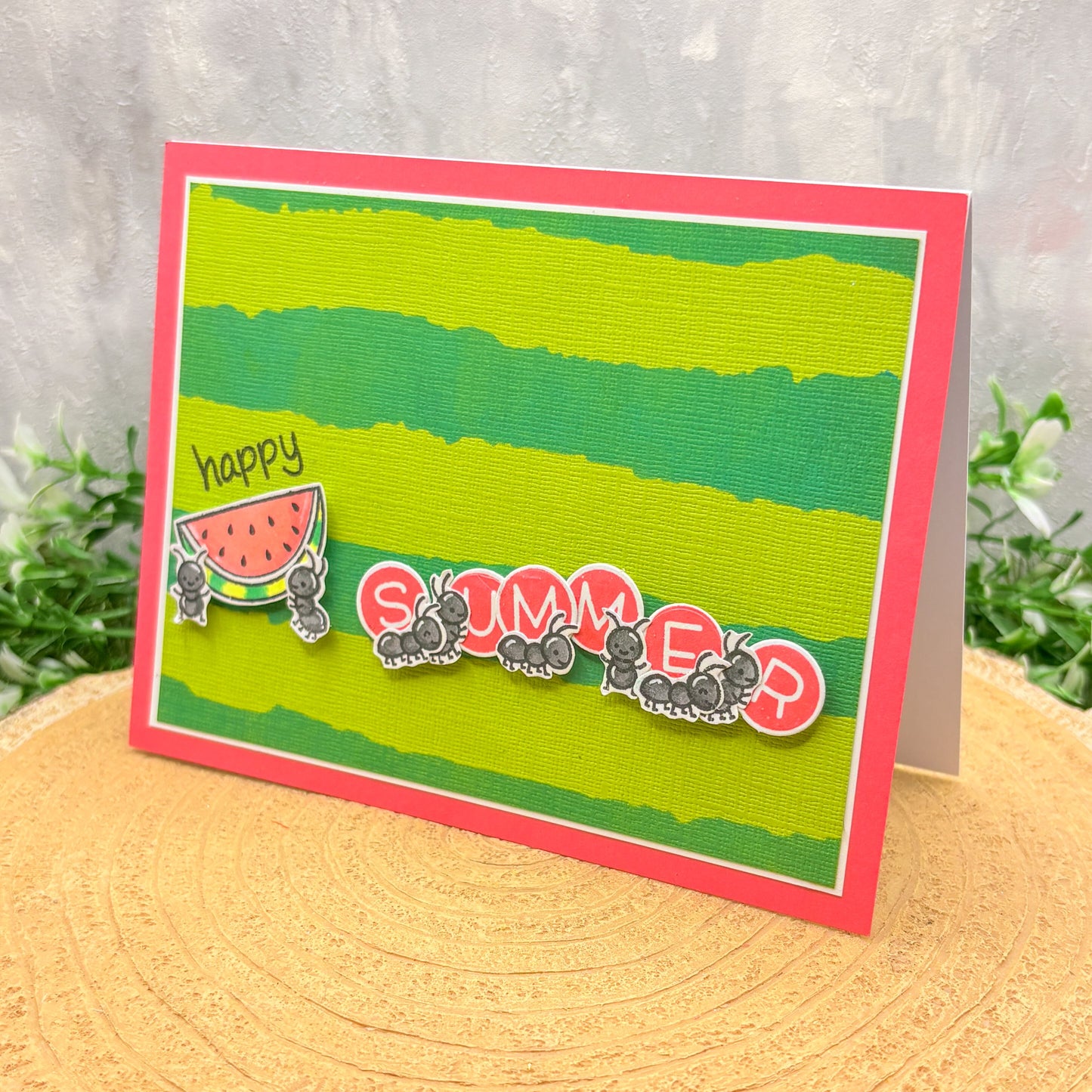 Card with 'Happy Summer' text and watermelon design on a green background