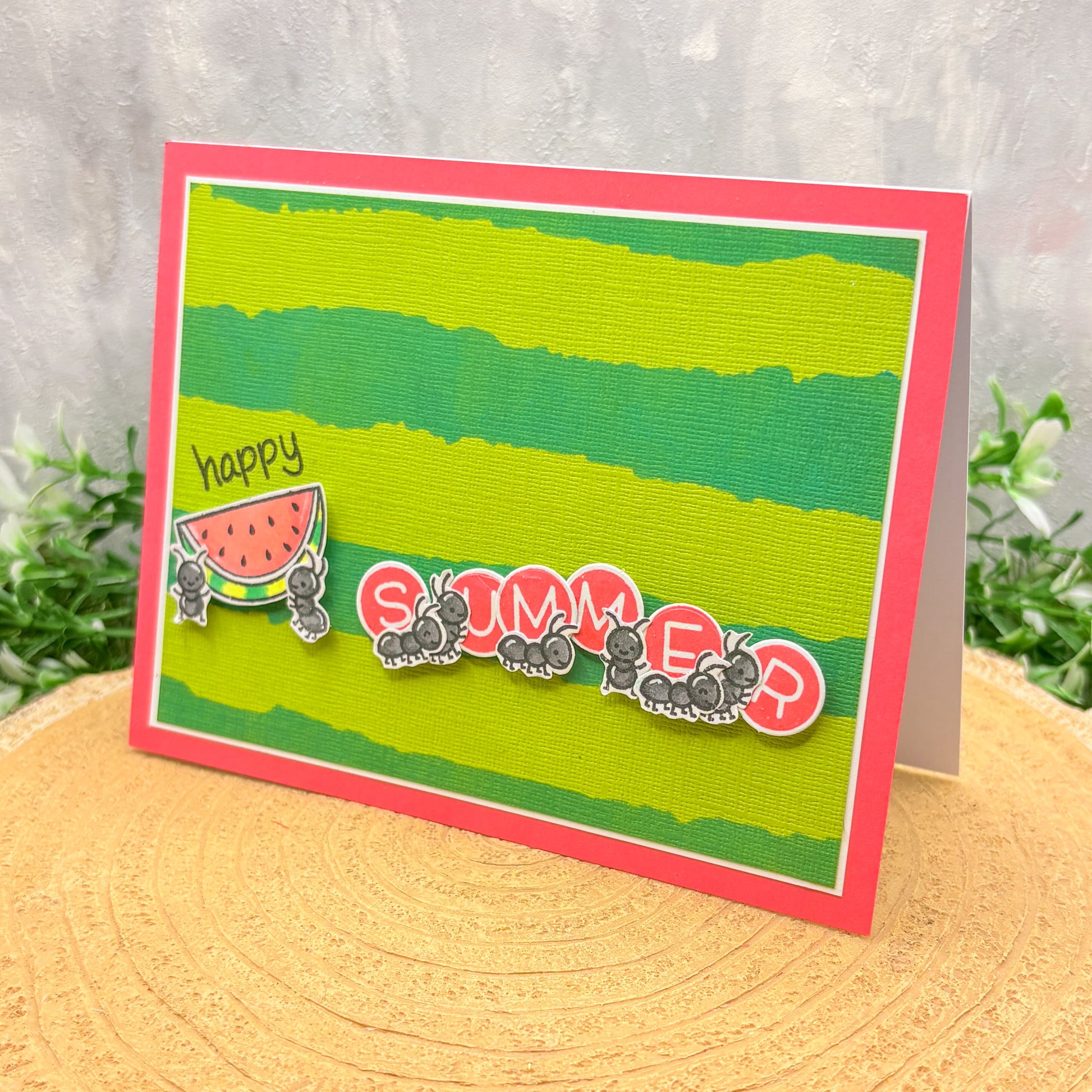 Card with 'Happy Summer' text and watermelon design on a green background