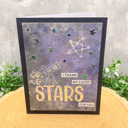 Handmade Thank You Card with a mouse, telescope, and 'I thank my lucky stars for you' text on a starry background.
