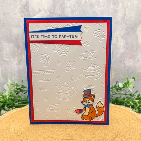 Card with a fox design and 'It's time to par-tea!' text on a textured background.